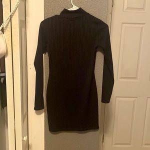 The black dress is a short but tight dress that is snug.